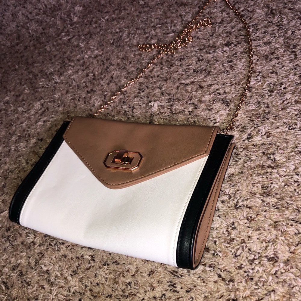 Black, tan and white clutch bag